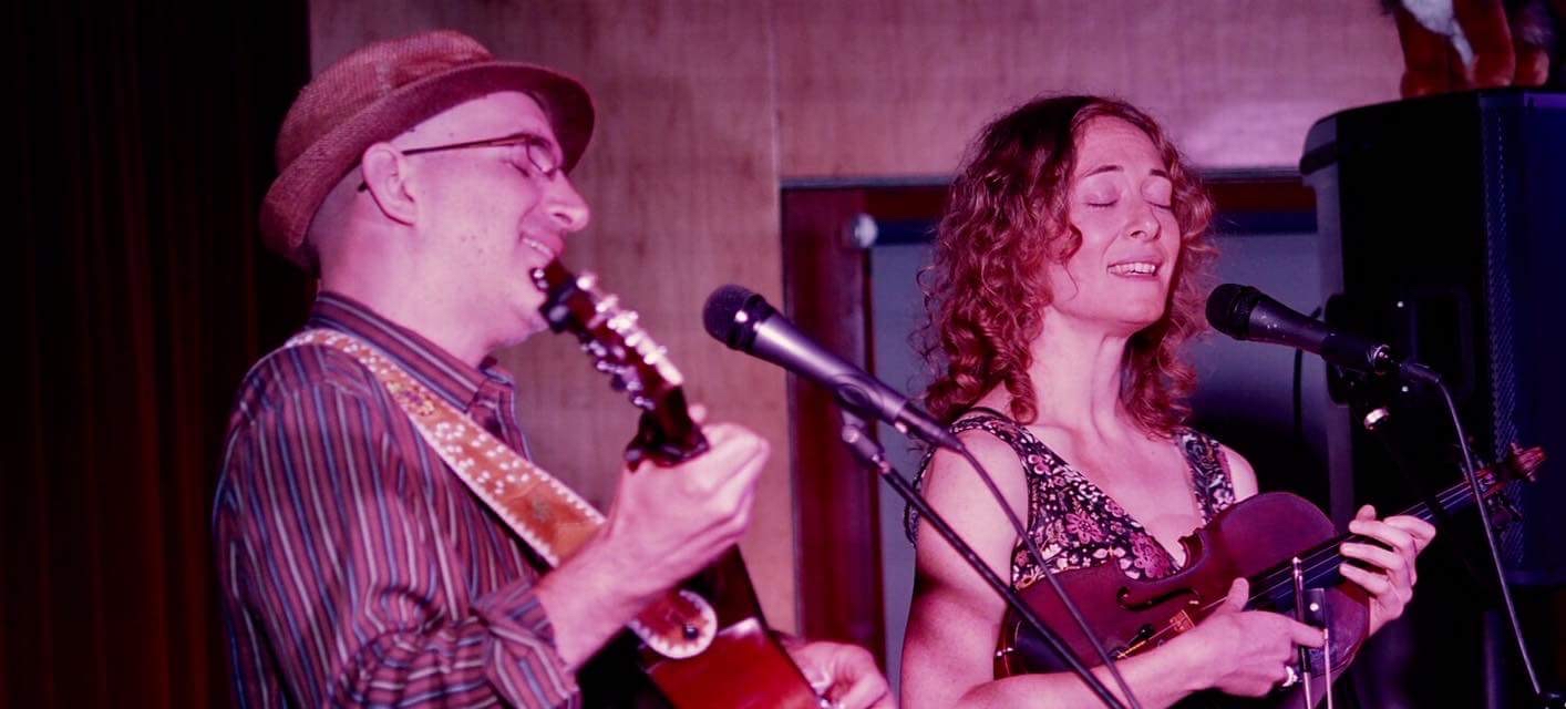 Dan Frechette & Laurel Thomsen performing on stage