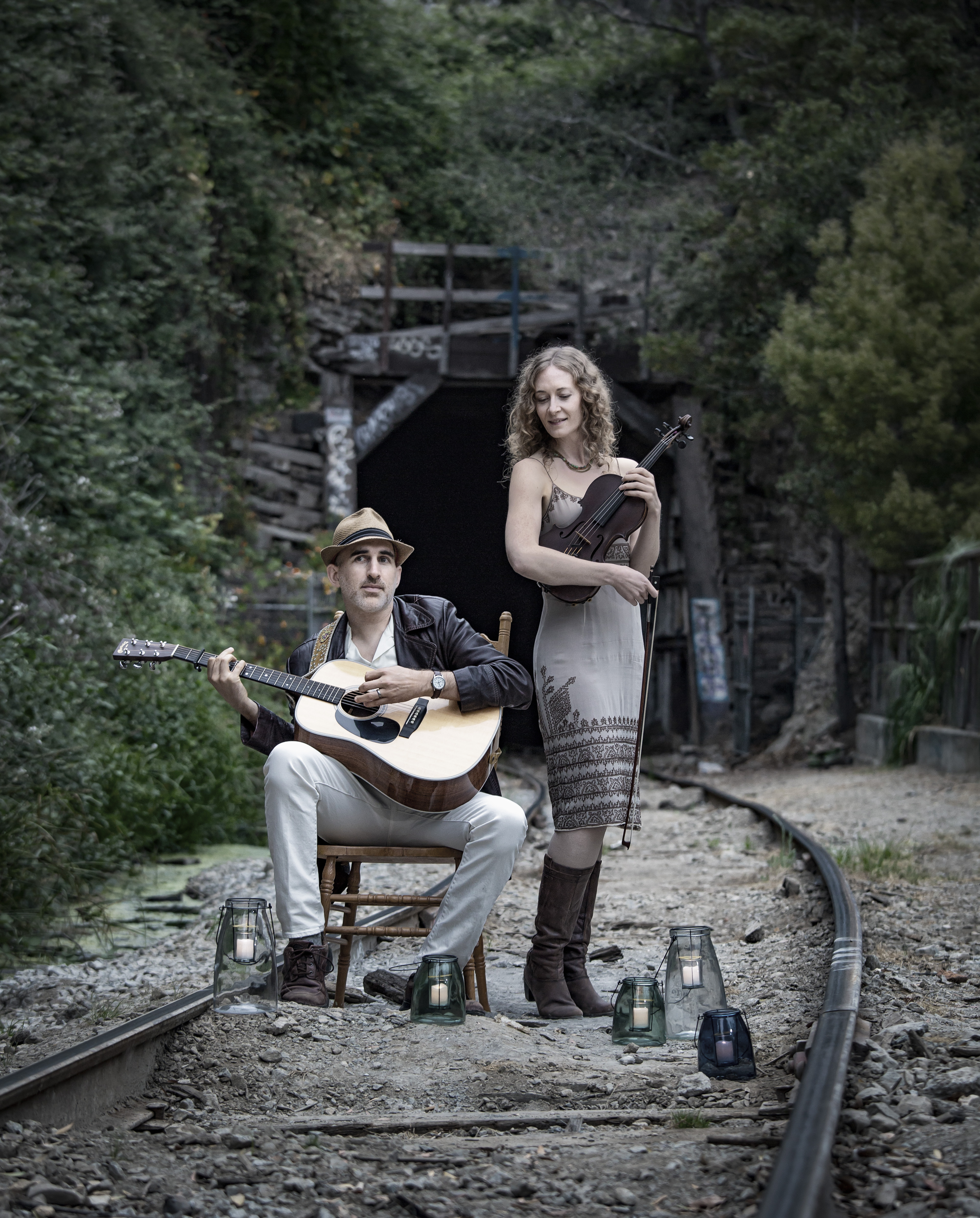 Dan Frechette & Laurel Thomsen standing on train tracks