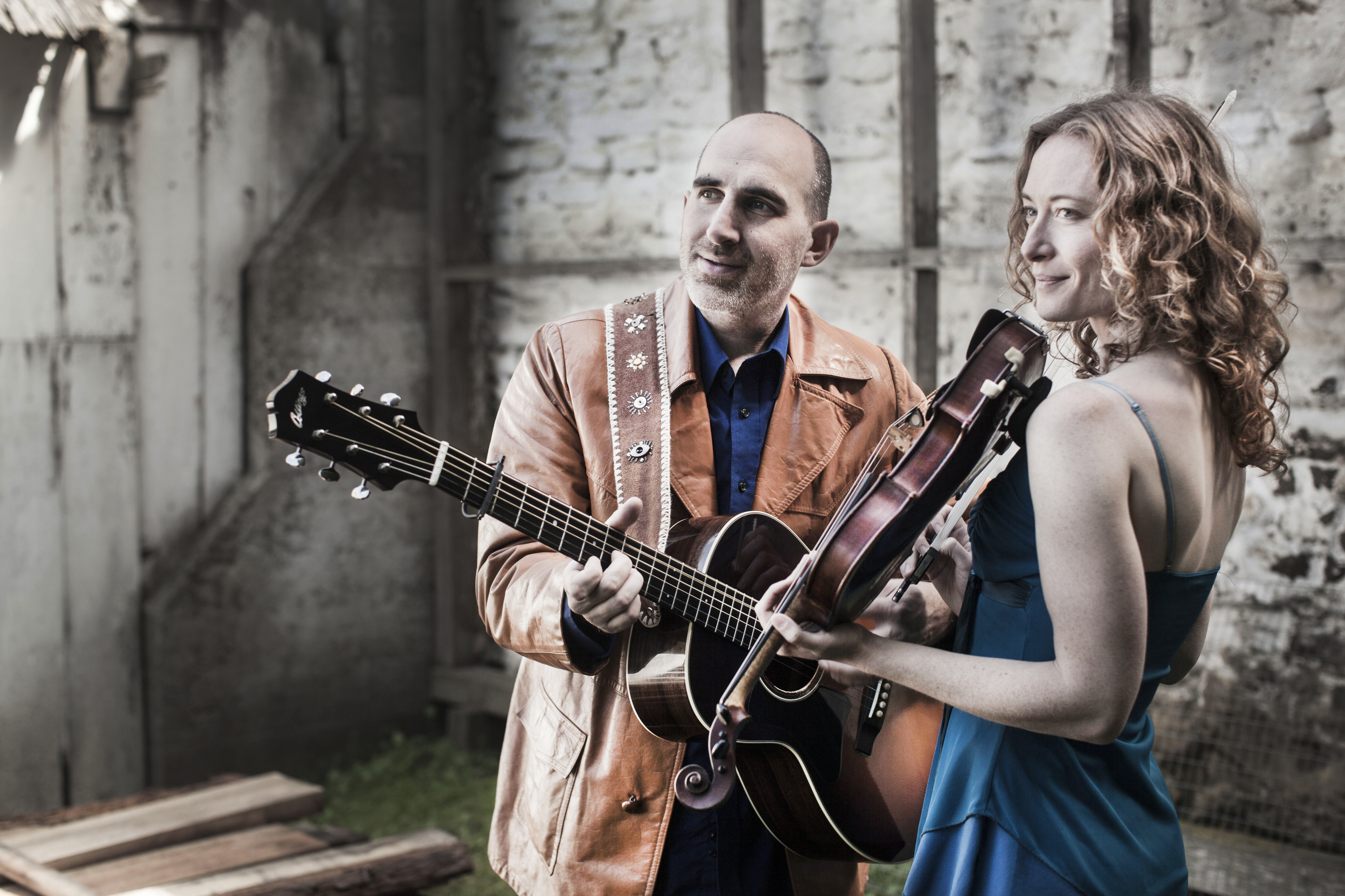 Dan Frechette & Laurel Thomsen posing with their instruments