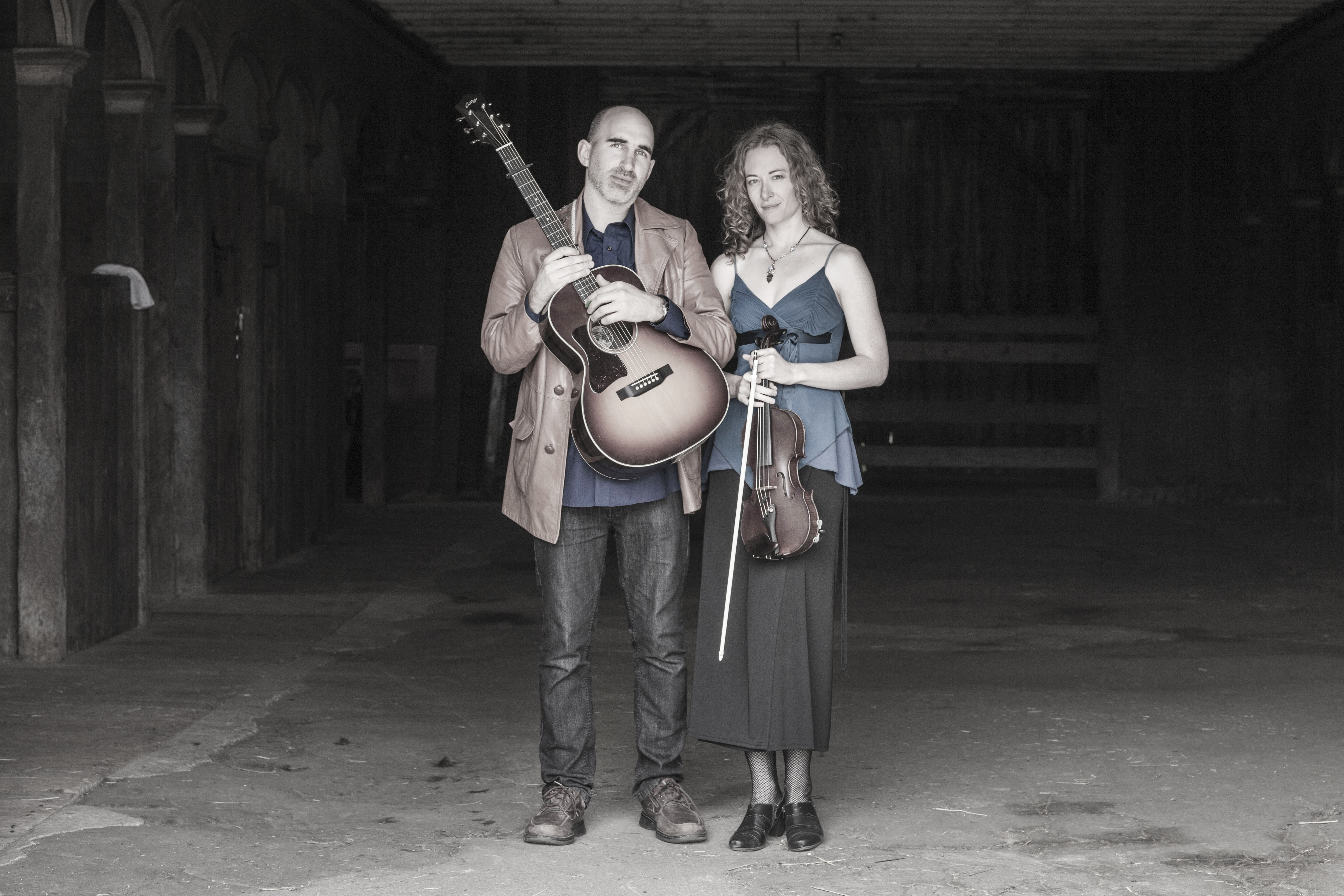 Dan Frechette & Laurel Thomsen posing with their instruments