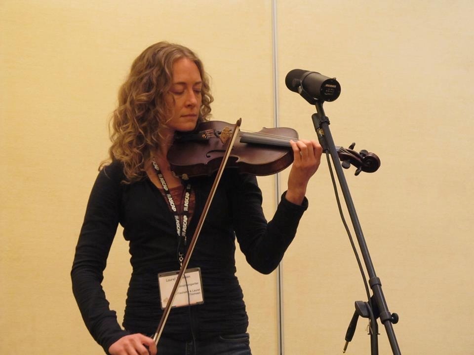 Violinist Laurel Thomsen performing at a Folk Conference