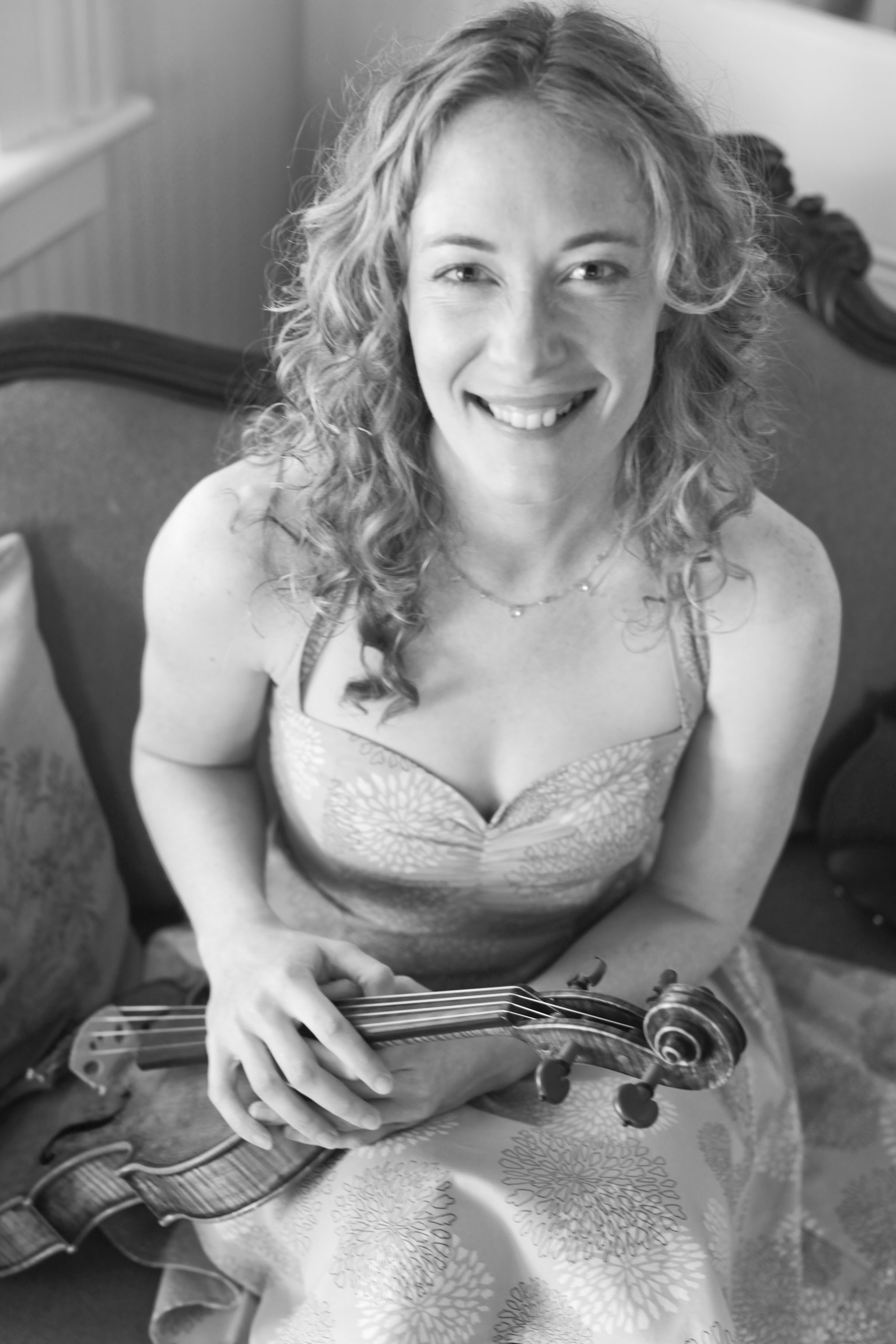 Laurel Thomsen with her laughing with her viola
